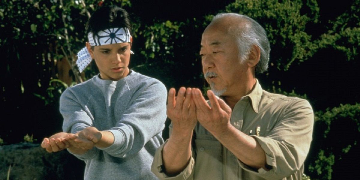 Pat Morita trains Ralph Macchio in The Karate Kid