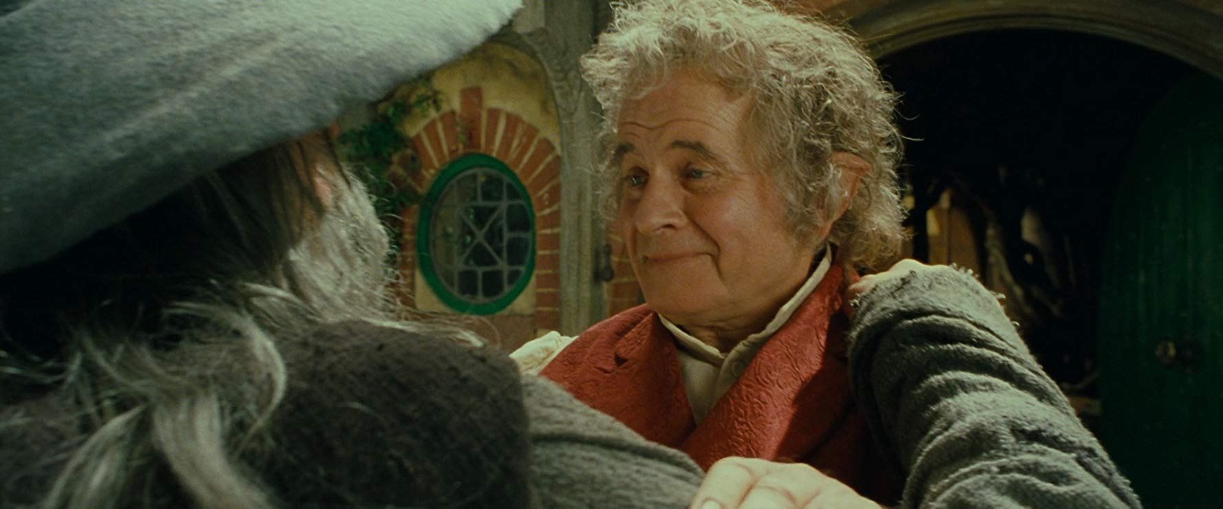  Ian Holm as Bilbo Baggins with Gandalf