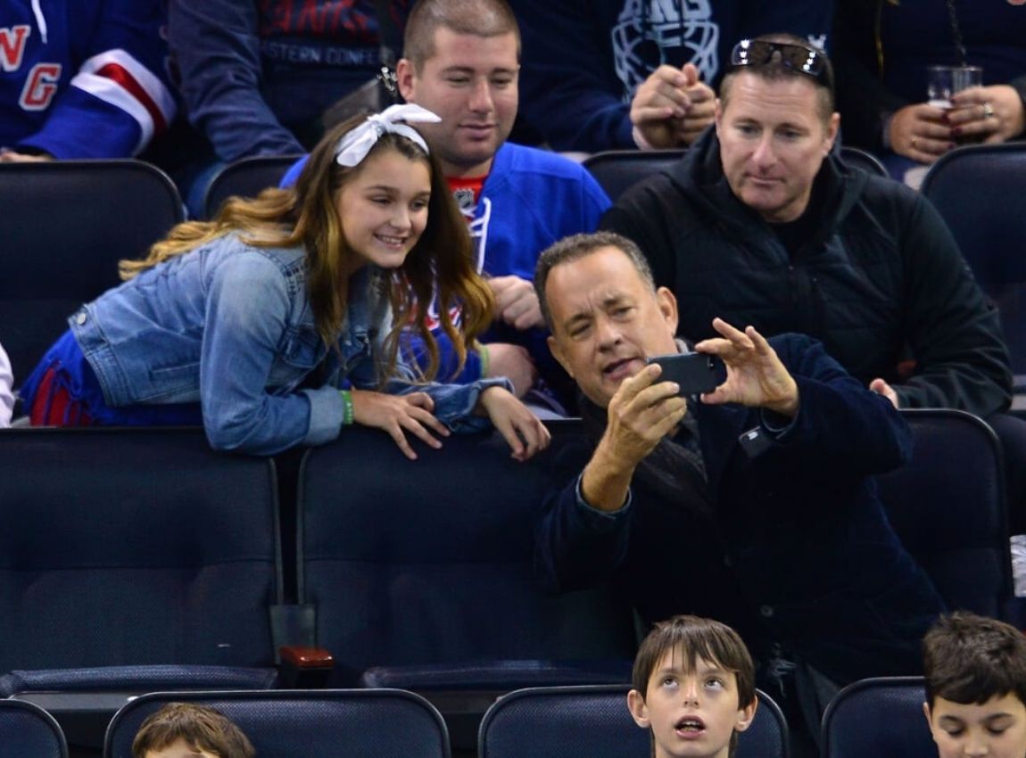 tom hanks taking picture with fans at game