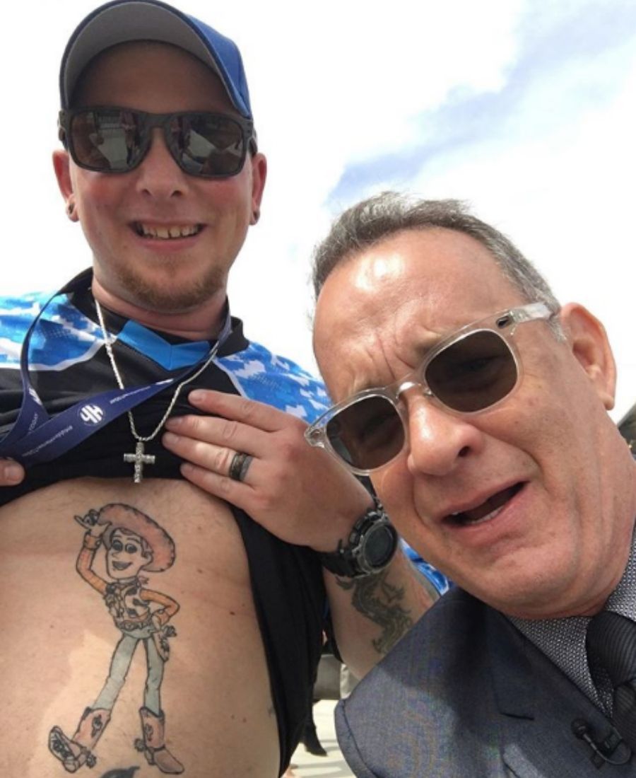 tom hanks with fan and woody tattoo