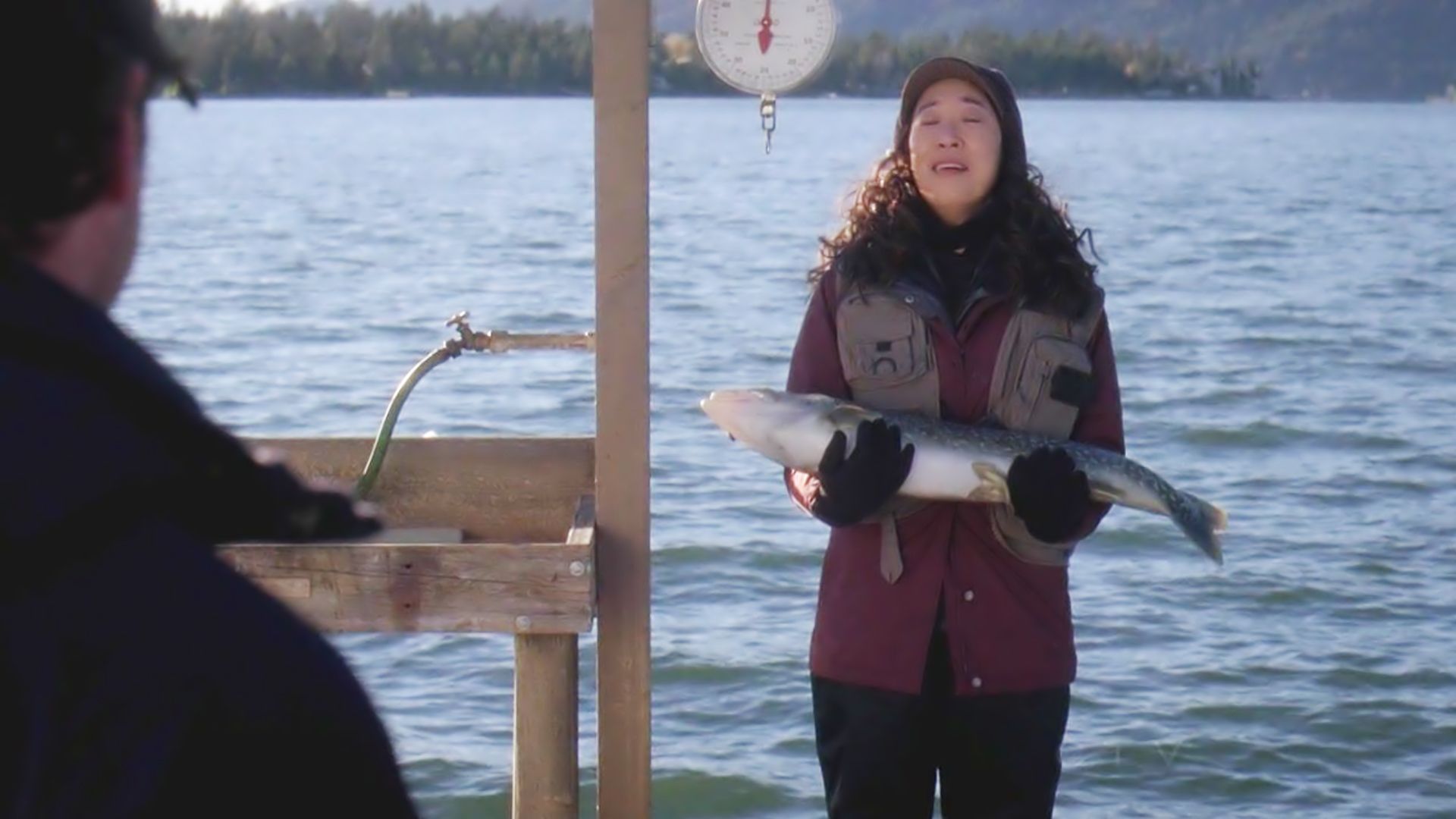 Cristina Yang on fishing trip, holding fish 