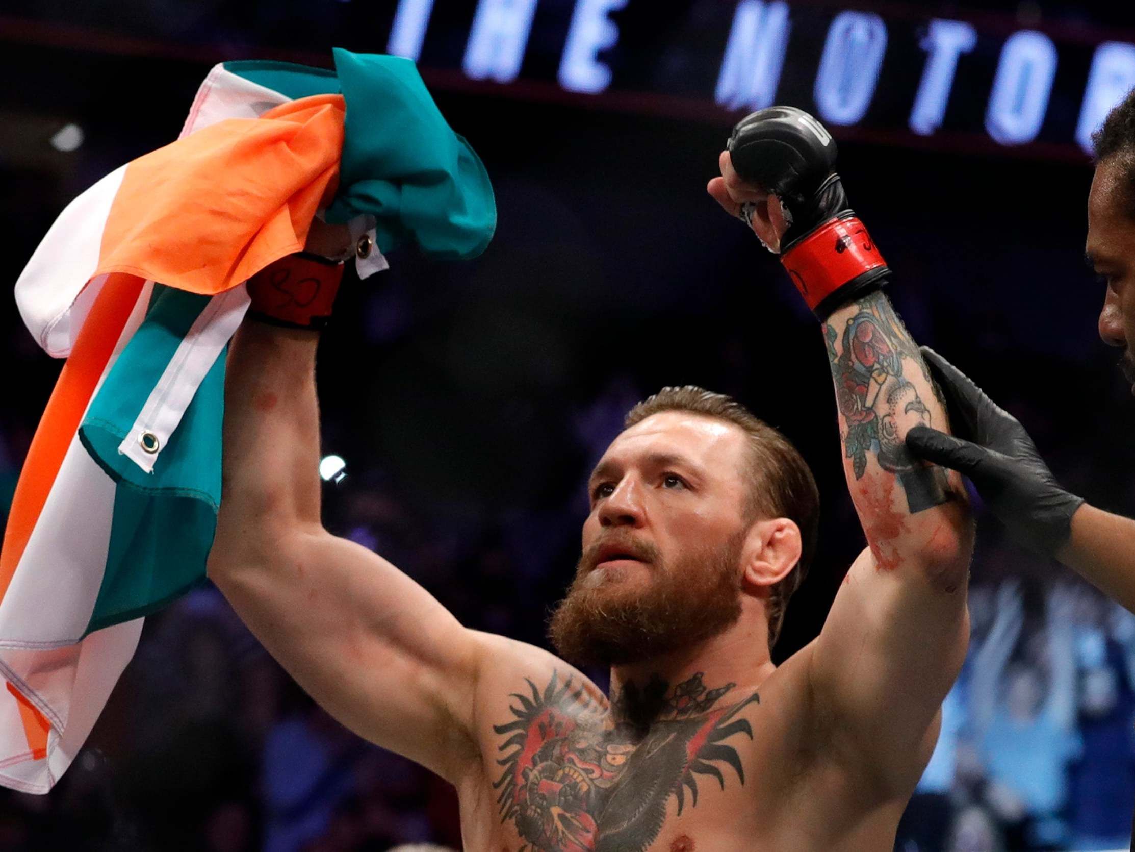 McGregor holding the Irish flag.