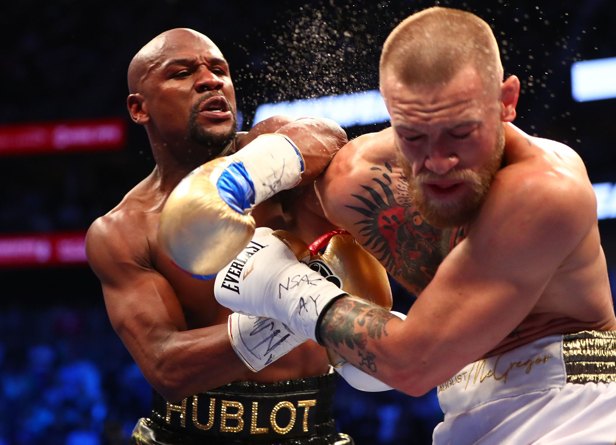 Floyd hits McGregor during their much-hyped fight.