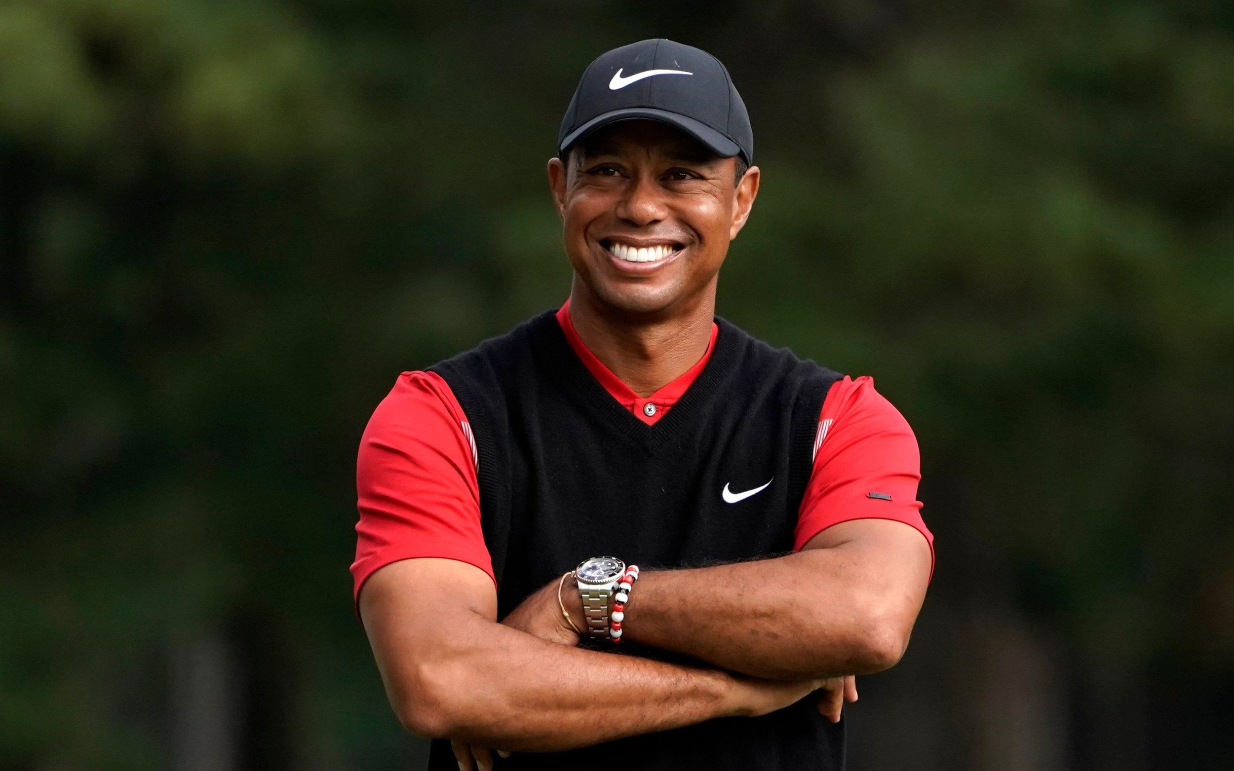 Tiger smiling on a course.