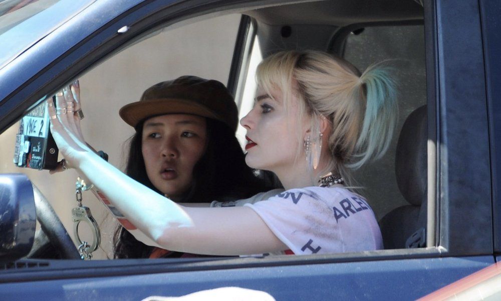 Harley Quinn driving in car with Cassandra Cain