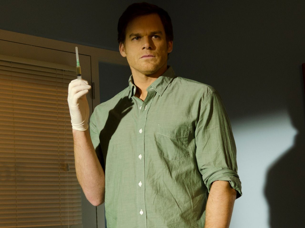Dexter Morgan with a syringe.