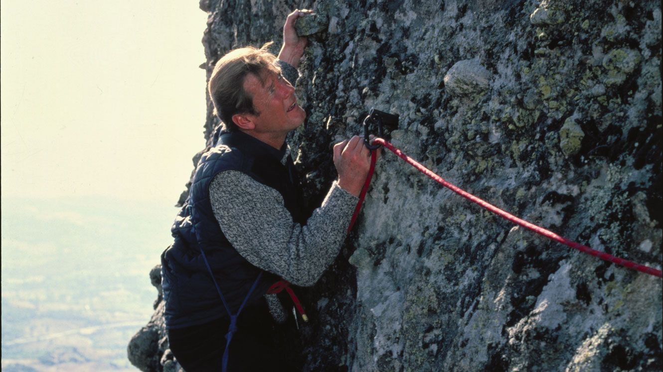 Roger Moore As Bond rock climbing