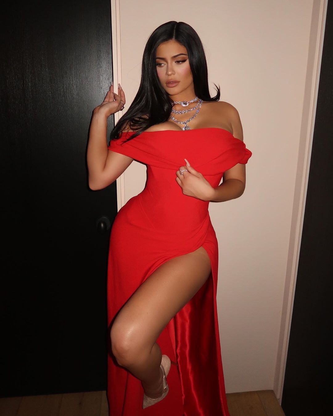 Kylie Jenner posing in red gown