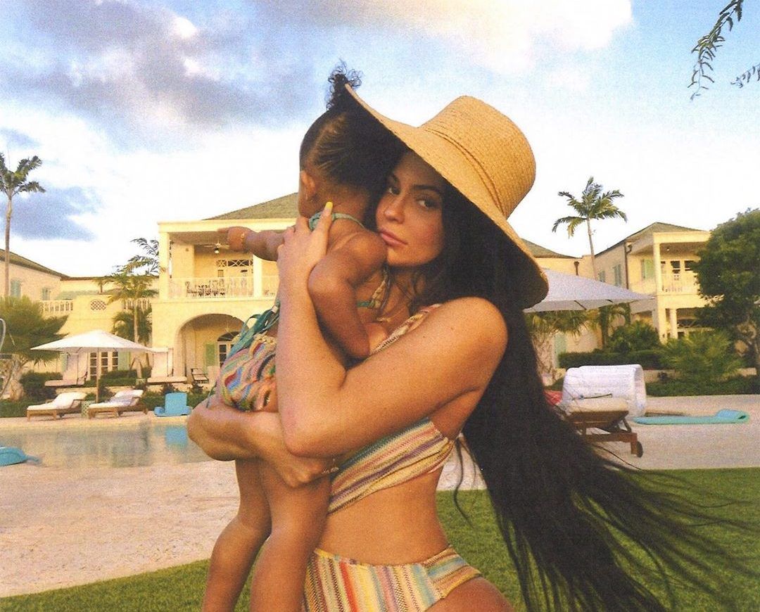 Kylie posing with Stormi while on vacation