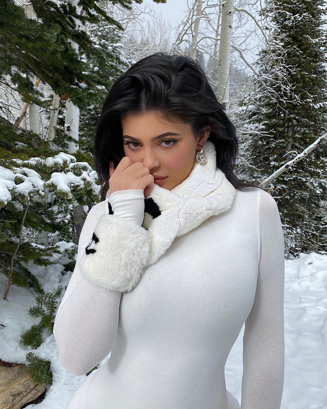 Kylie Jenner posing in white Chanel bodysuit on winter vacation