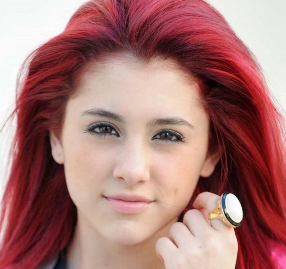 Ariana Grande young with red hair and big ring on white