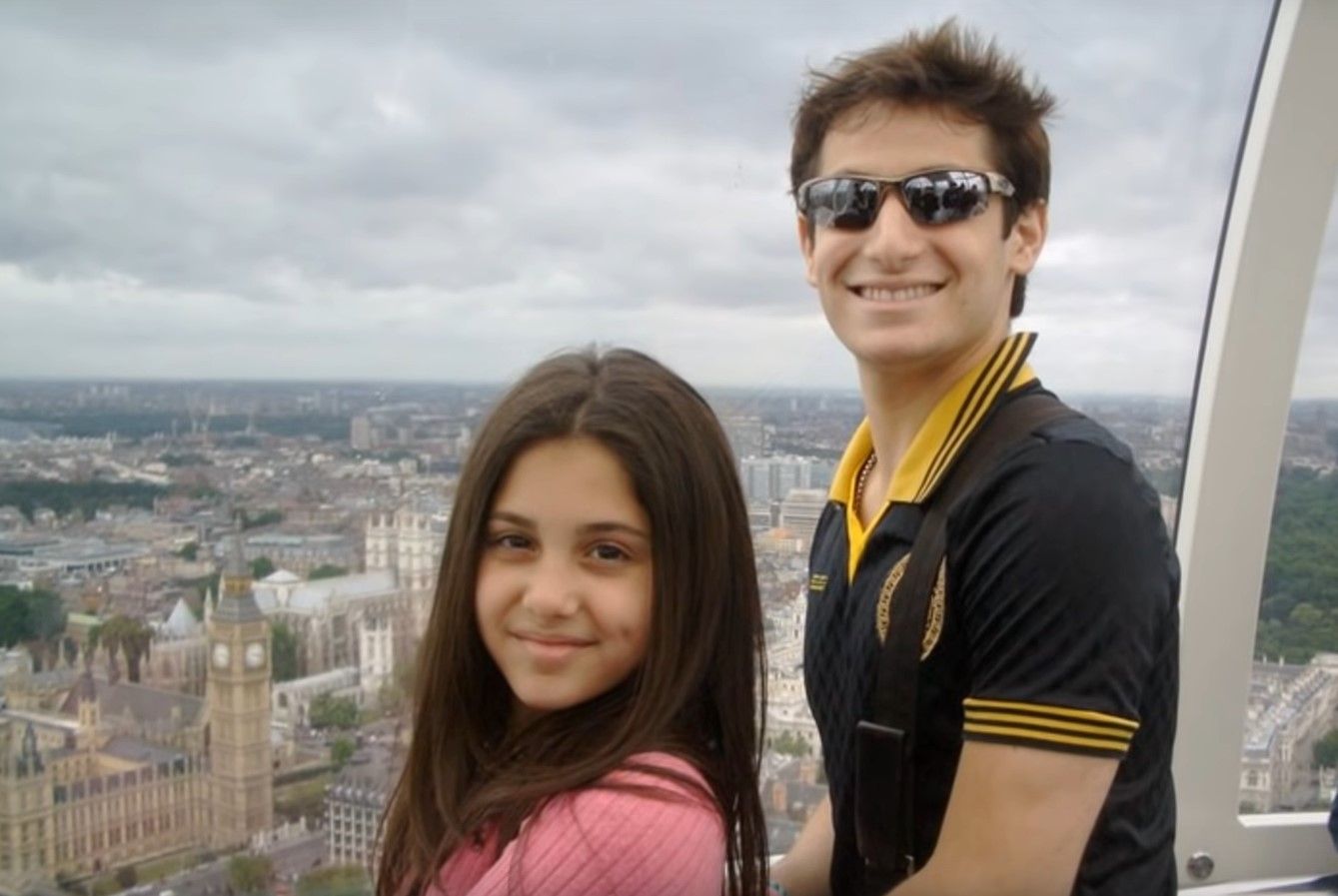 Ariana and Frankie Grande young overlooking city