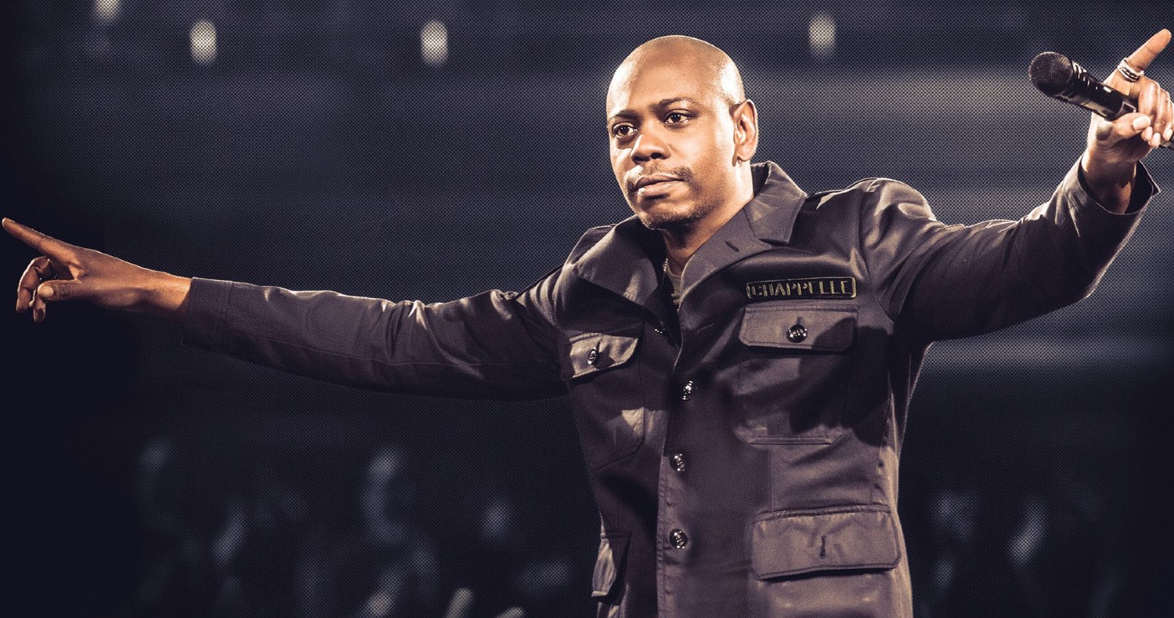 Dave Chappelle in front of a crowd