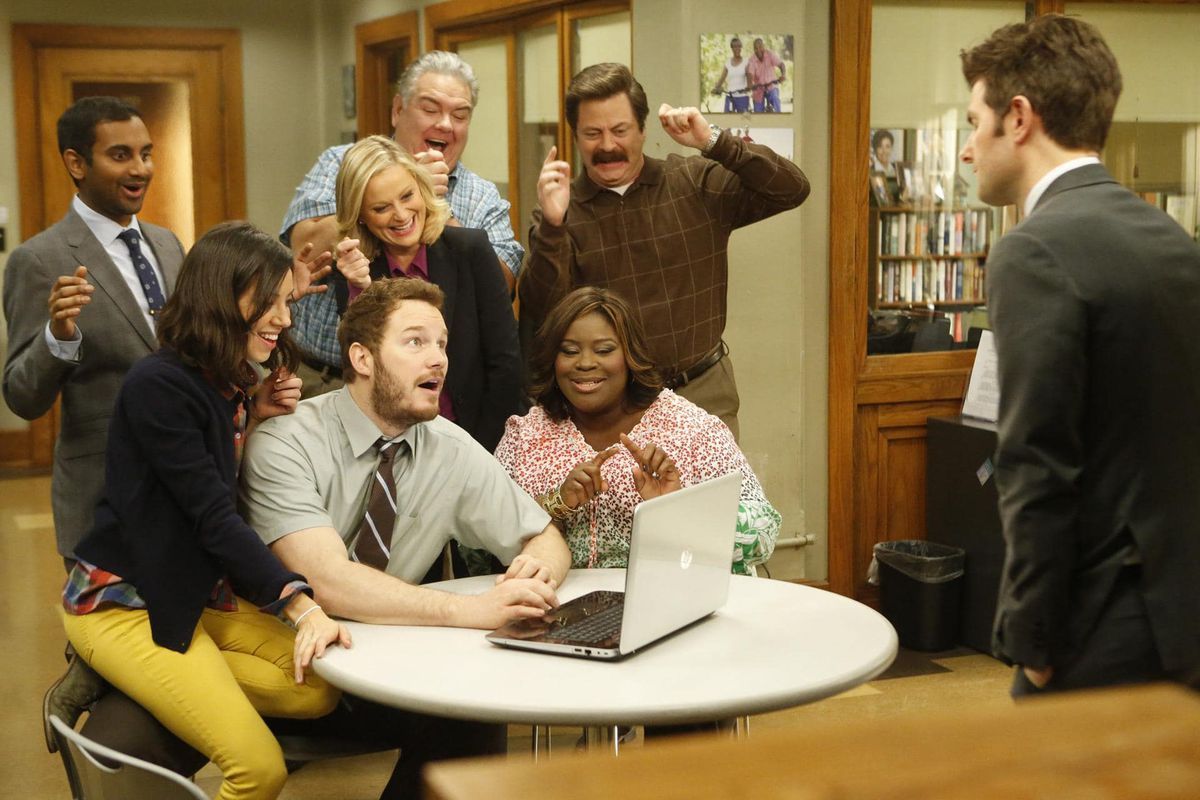 Parks and Recreation Cast Huddled Around Andy's Laptop