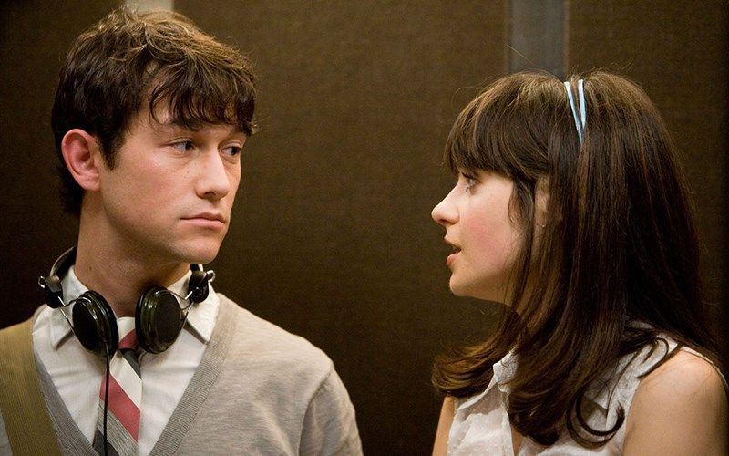 Tom and Summer are standing in an elevator in the romantic comedy 500 Days of Summer