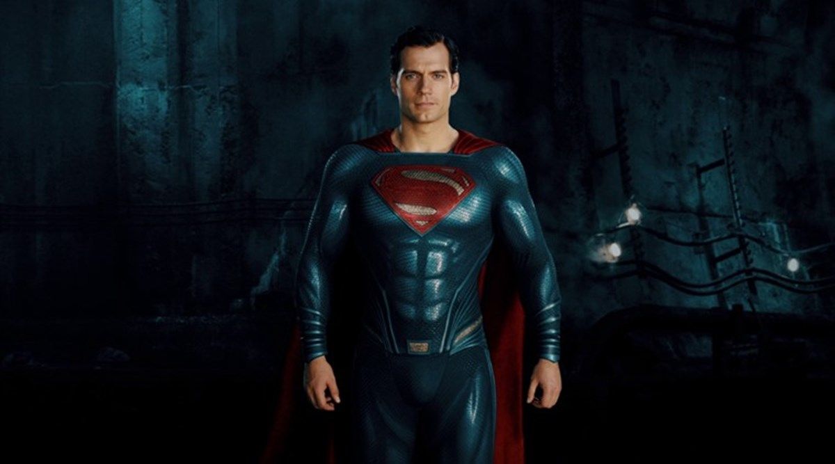 Henry Cavill dressed as Superman, levitating.