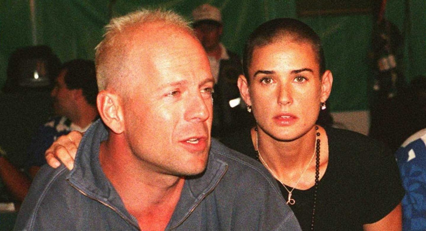 bruce willis with blonde hair posing with demi moore shaved head