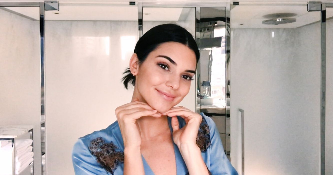 Kendall Jenner holding her hands under her chin
