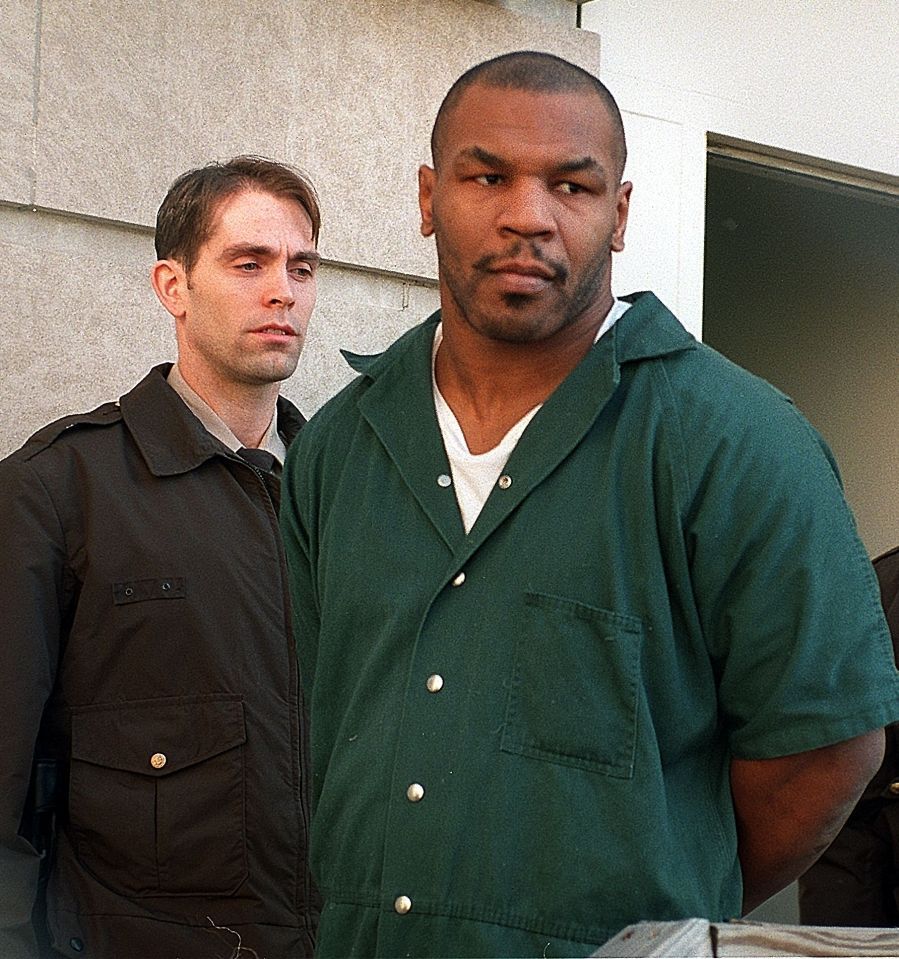 Mike Tyson steps out of the courtroom following his rape trial
