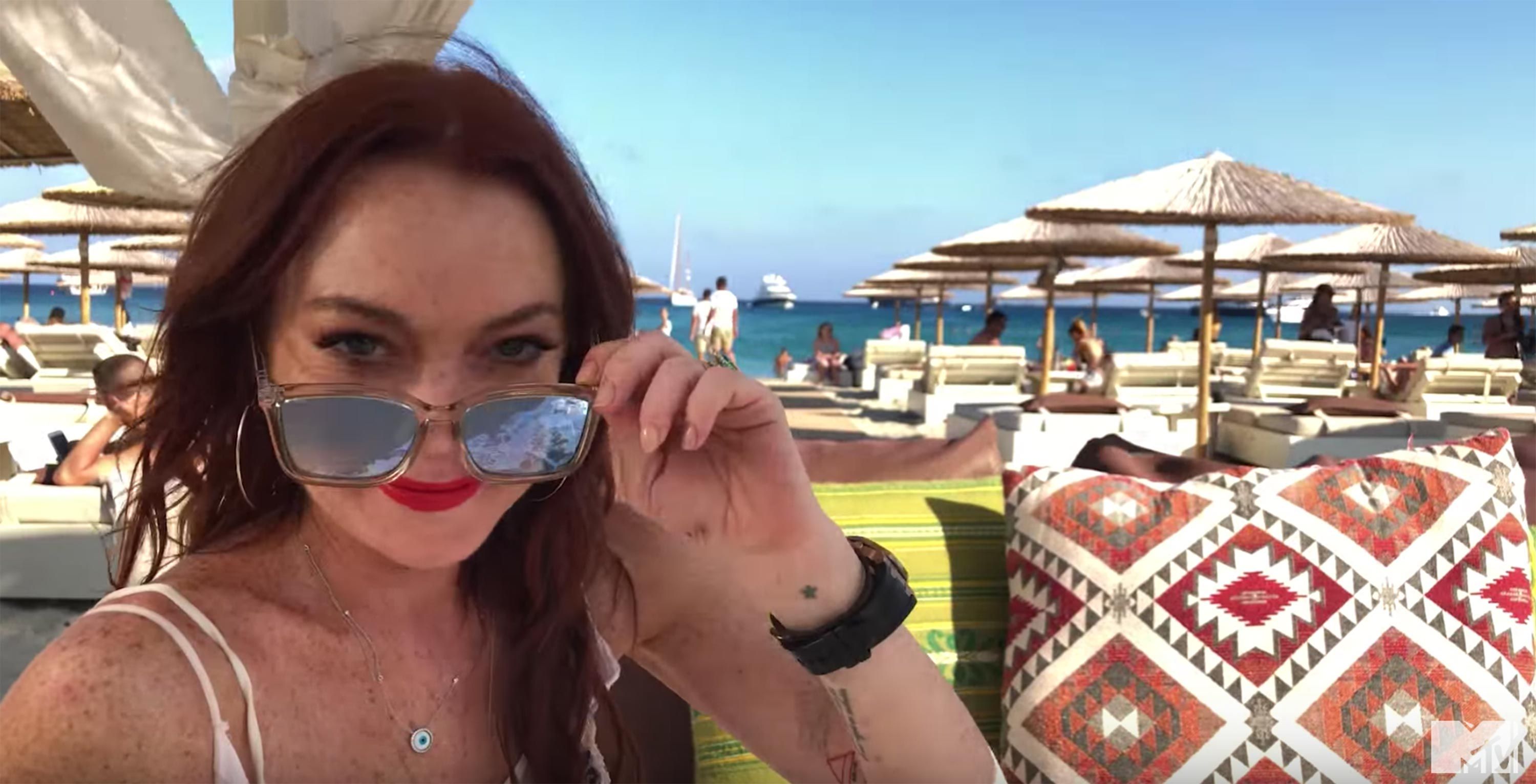 Lindsay Lohan lounging beach side at her resort