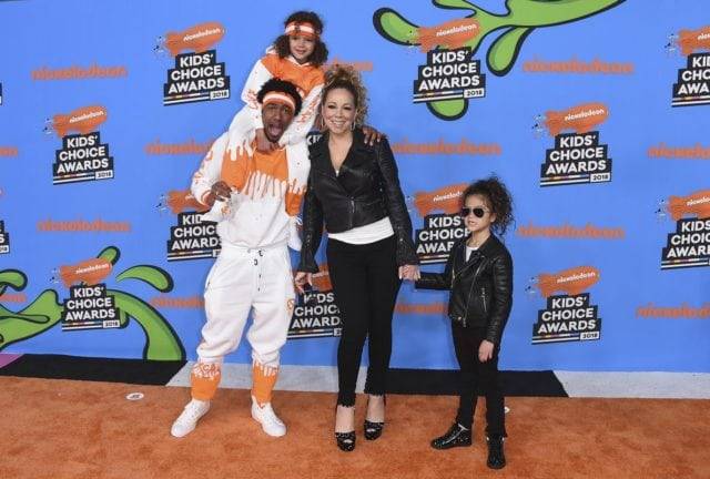 nick cannon on the runway with his family