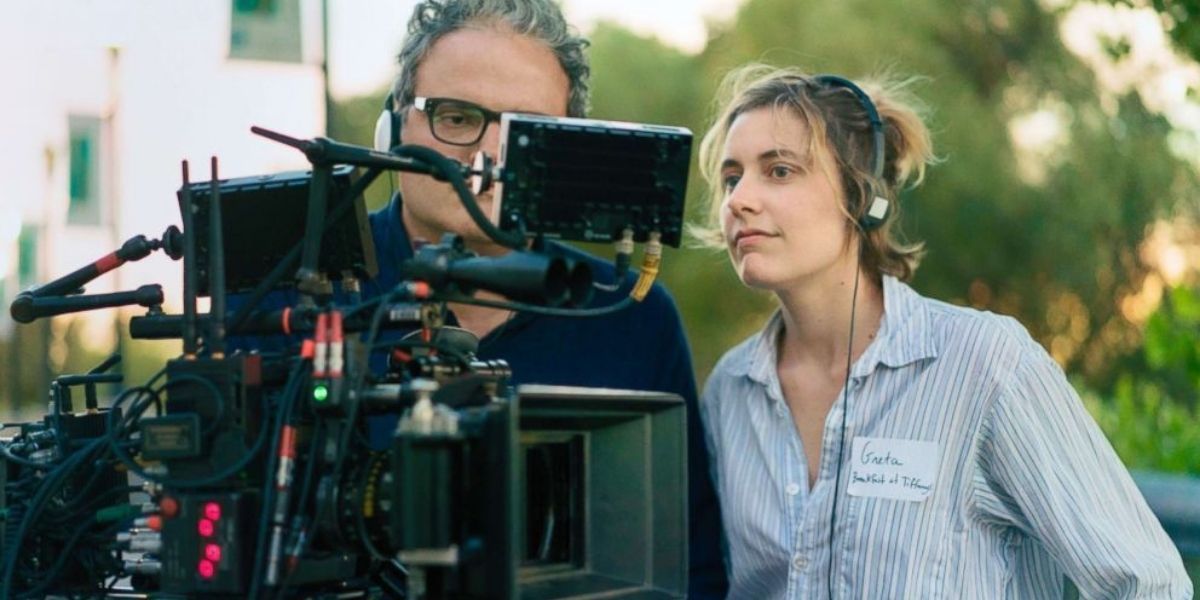 Greta Gerwig looking at a shot with her cinematographer 