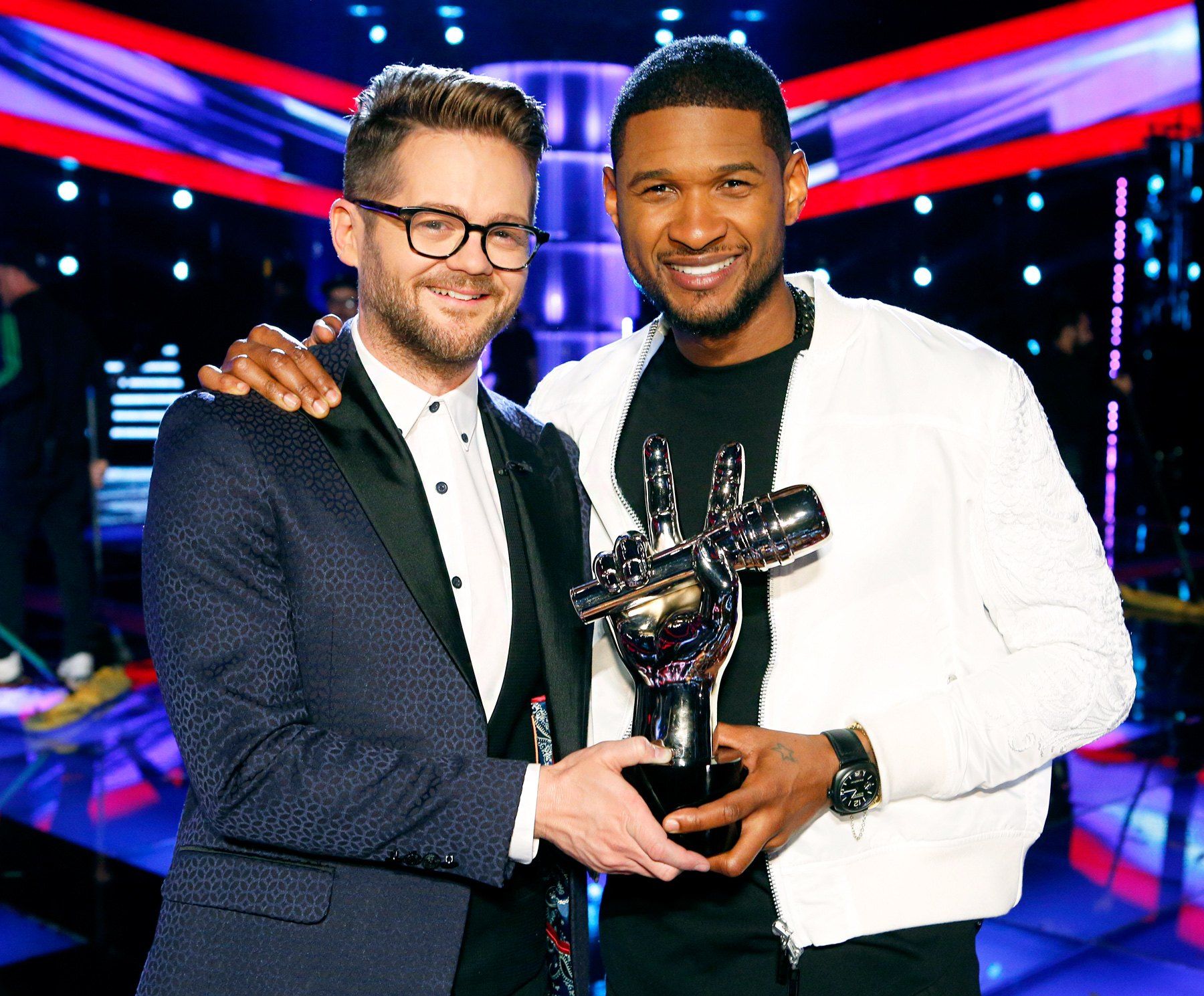 Josh Kaufman and Usher holding The Voice Trophy