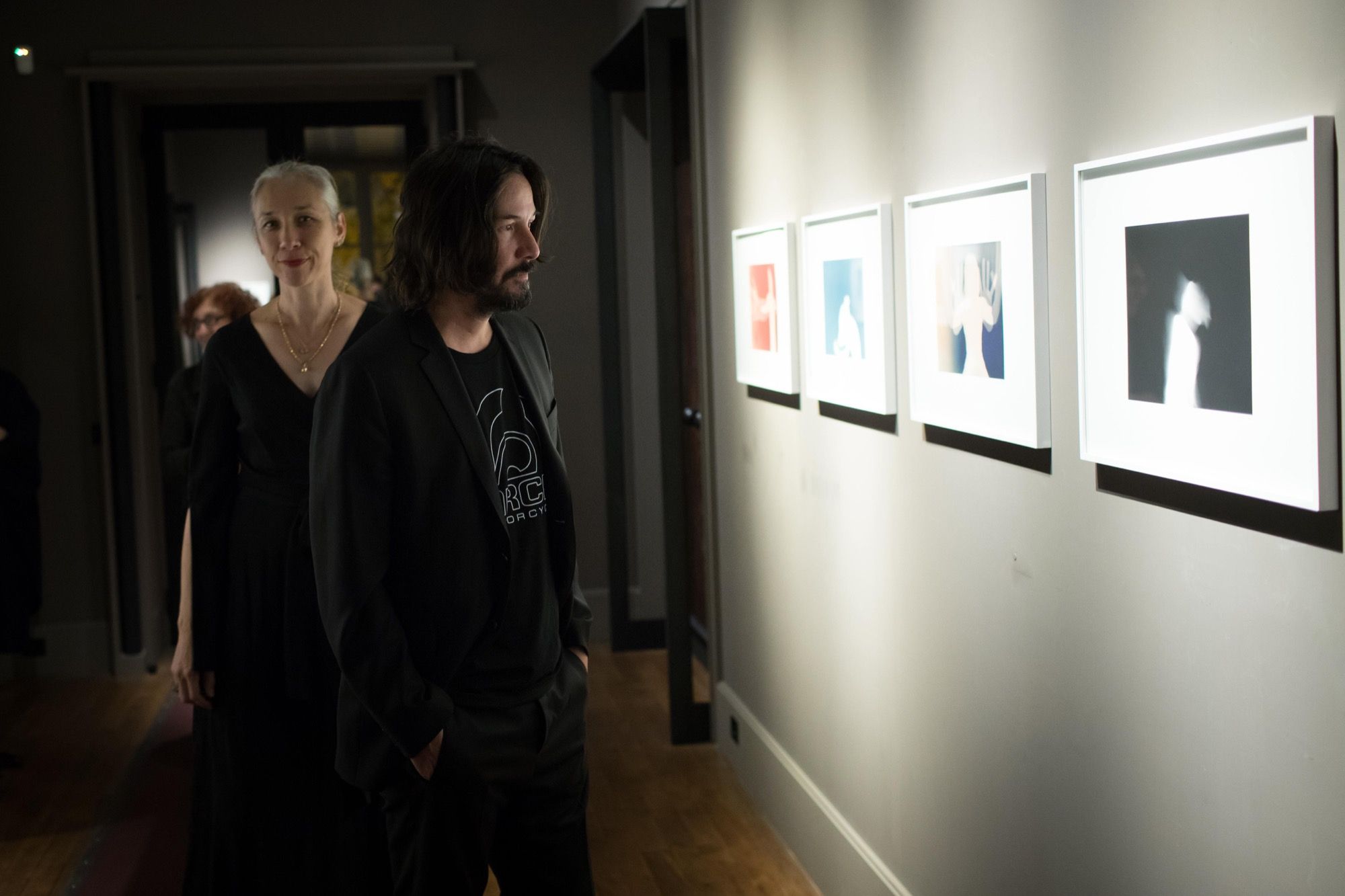Alexandra Grant and Keanu Reeves at an exhibition of 'Shadows' in Paris