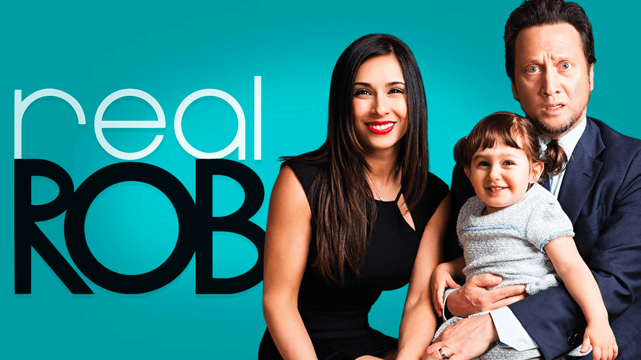 Real Rob TV poster with Rob and Patricia Schneider holding their daughter, Miranda.