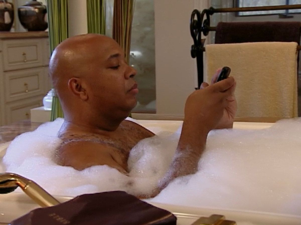 Rev Run Typing on Phone in a Bath Tub