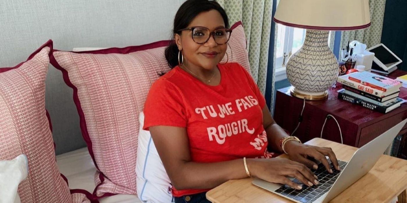 Mindy Kaling writing in bed