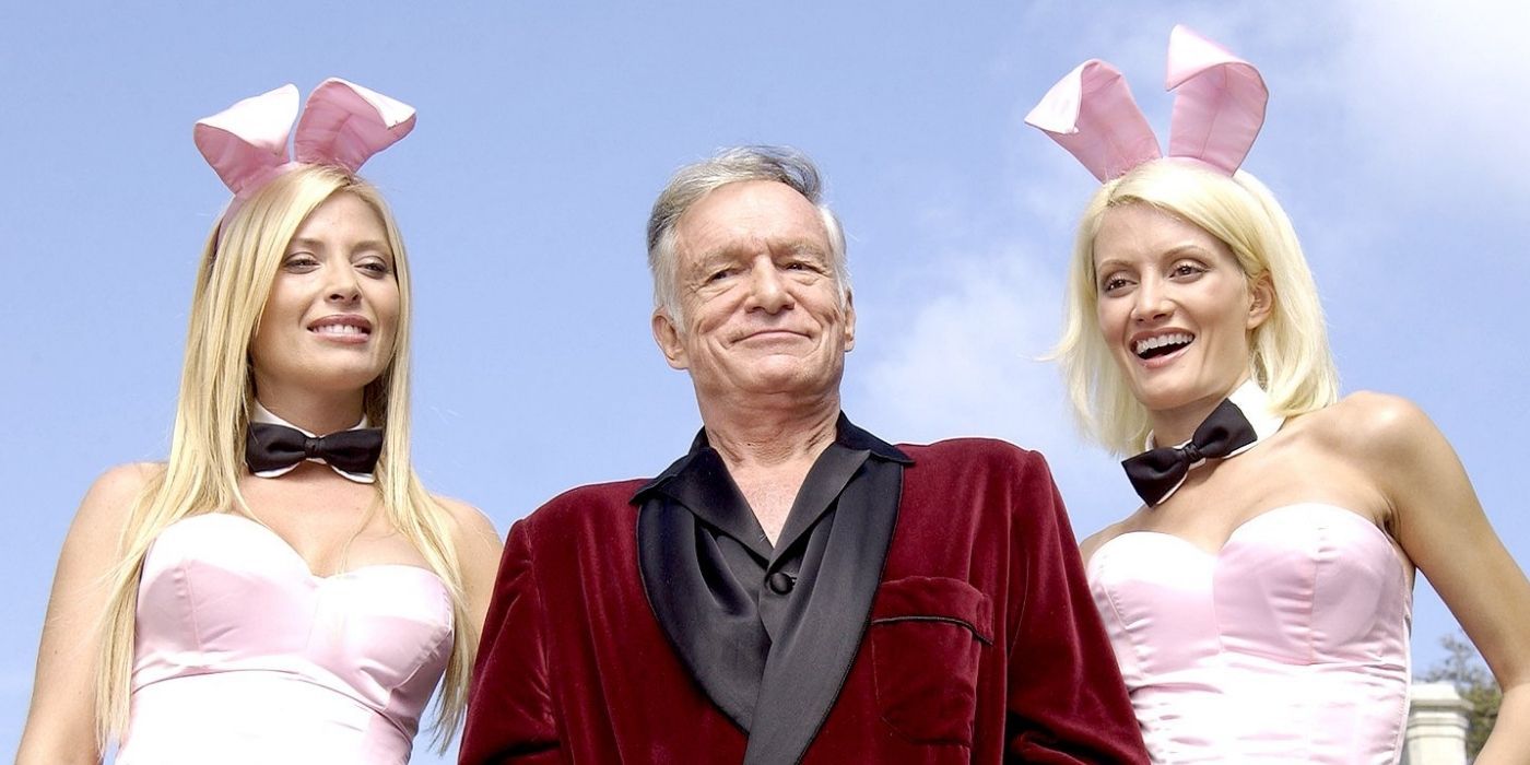 Hugh Hefner of Playboy with two Playboy bunny models