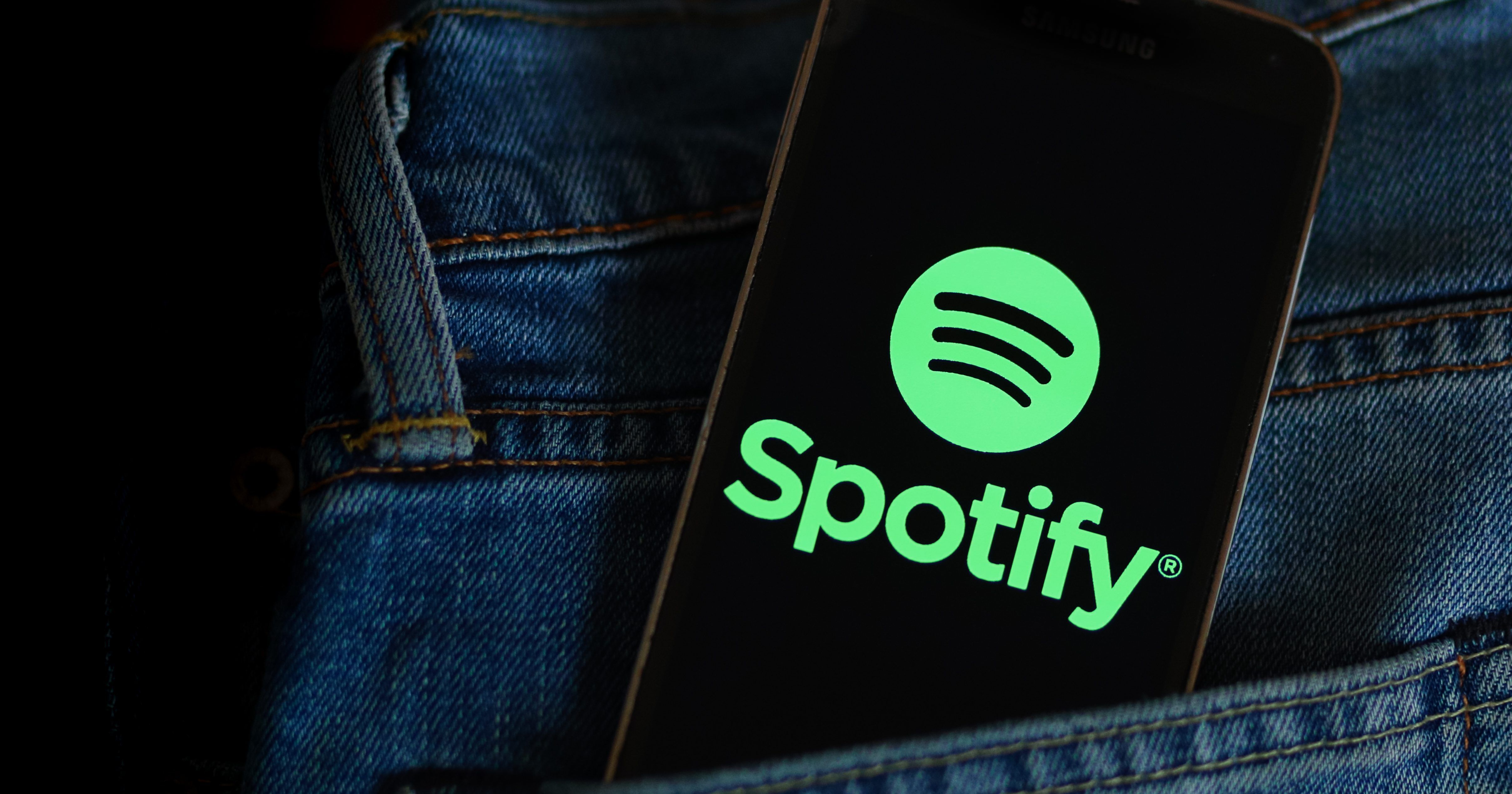 POLAND - 2021/03/22: In this photo illustration, a Spotify music app logo seen displayed on a smartphone. (Photo Illustration by Filip Radwanski/SOPA Images/LightRocket via Getty Images)