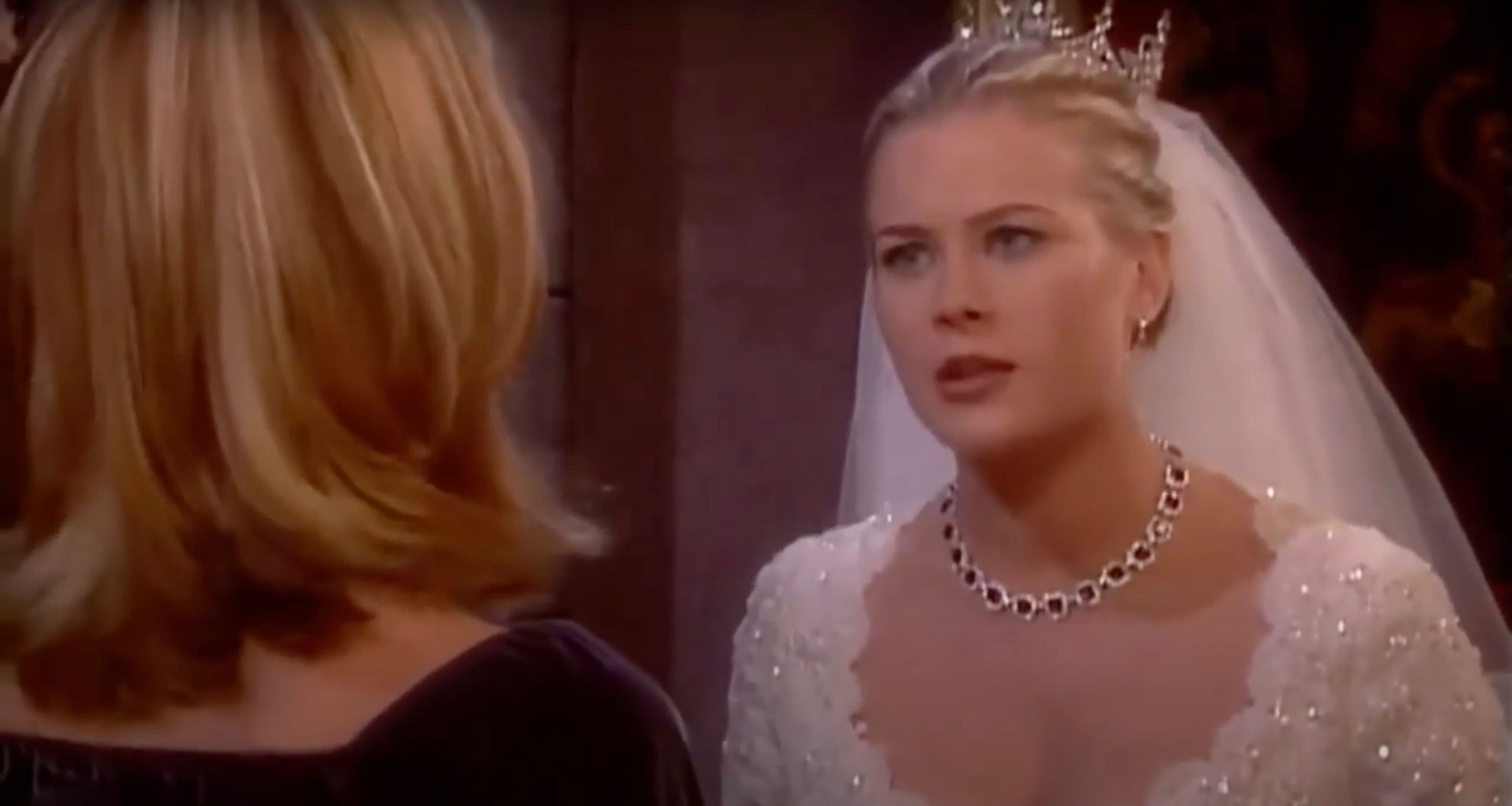 Carrie talking to Sami who looks upset and is wearing a wedding dress in Days Of Our Lives.