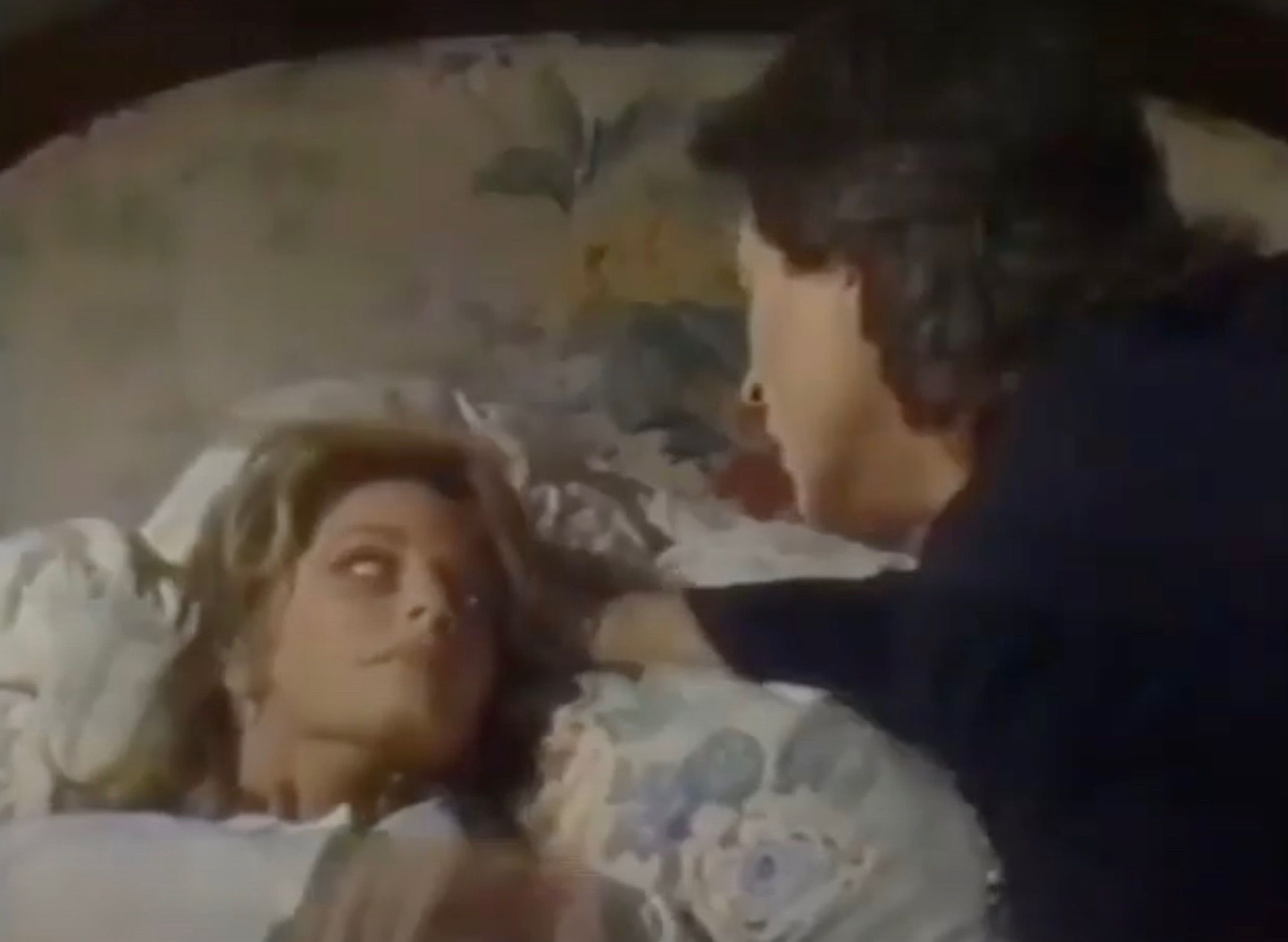 Marlena possessed looking at the priest who's putting his hand on her head in Days Of Our Lives.