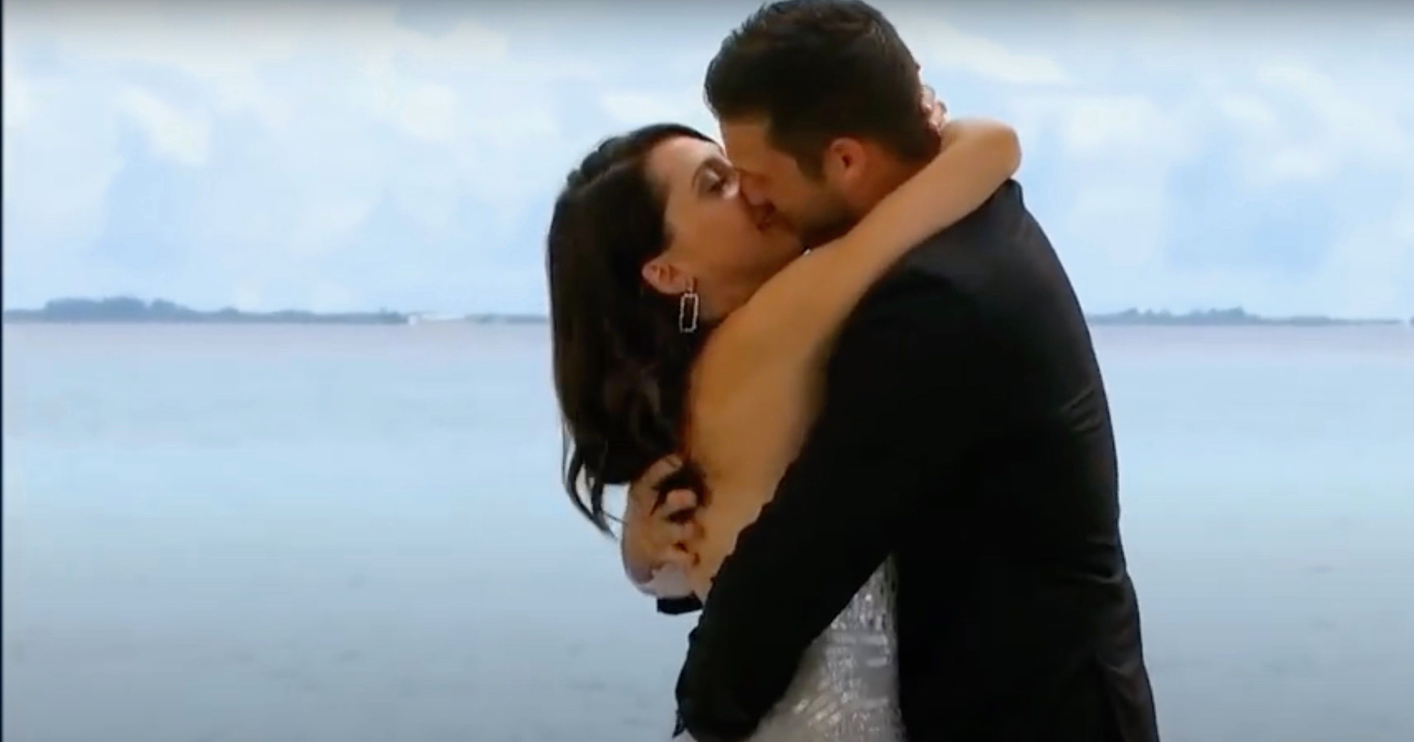 Becca kissing Garrett after he proposes to her in The Bachelor.