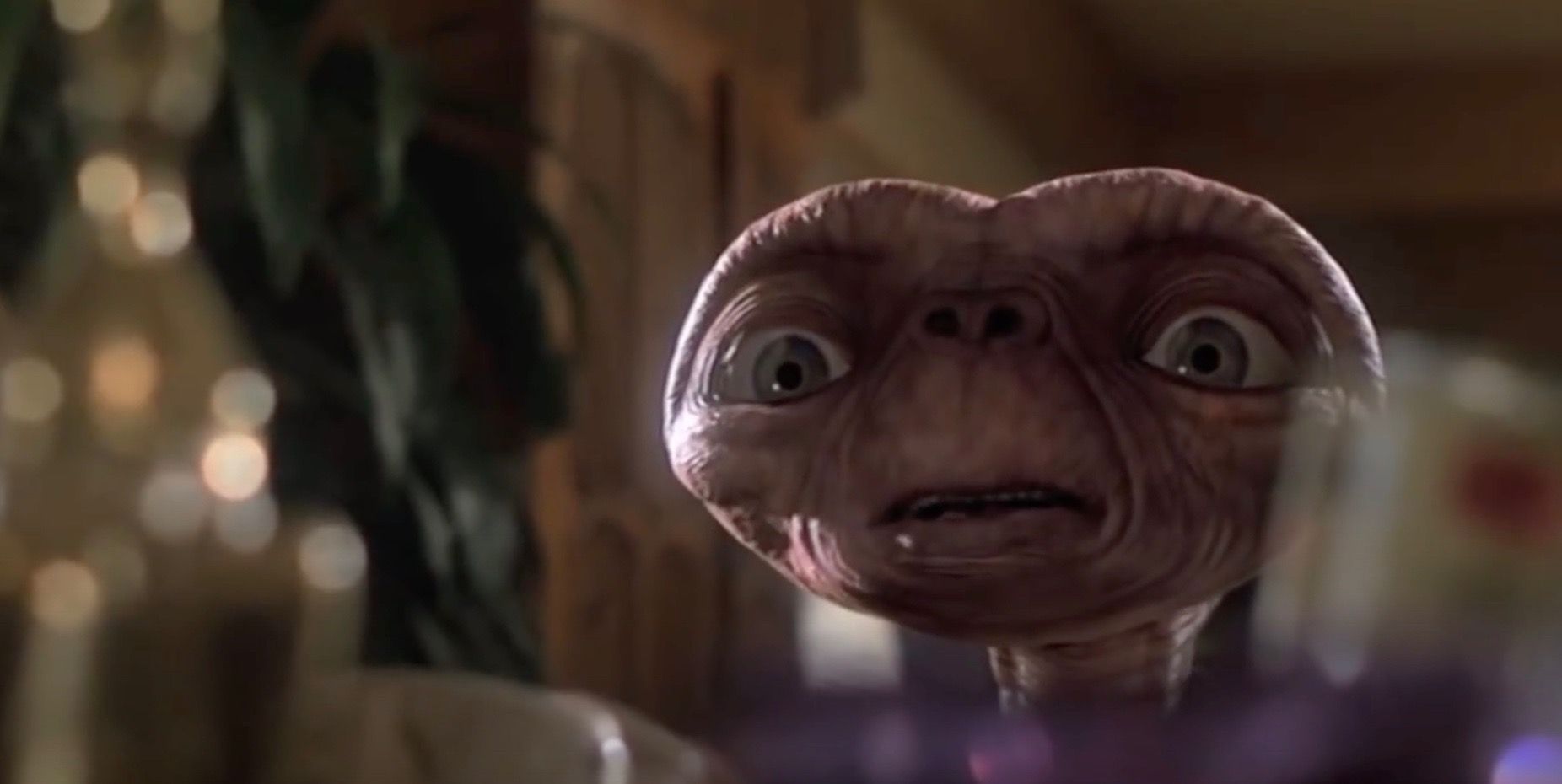 E.T. looking scared while watching TV.
