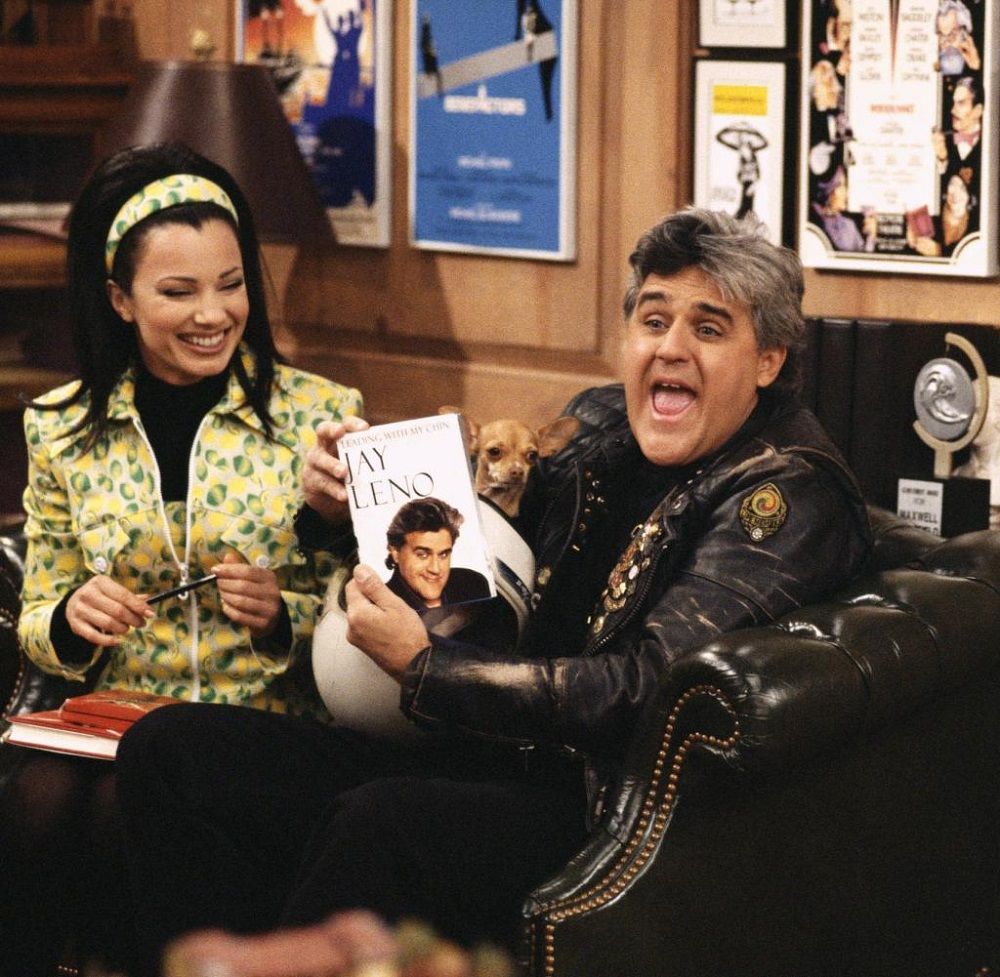 Jay Leno and Fran showing his book