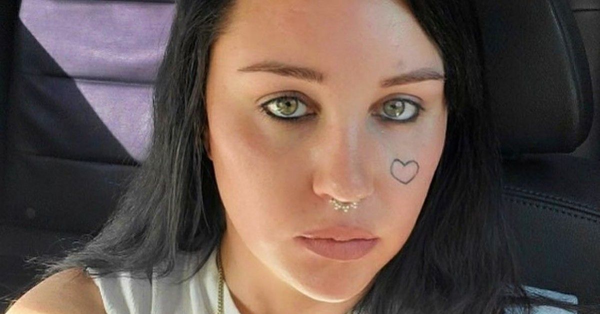 Amanda Bynes with face tattoo and black hair