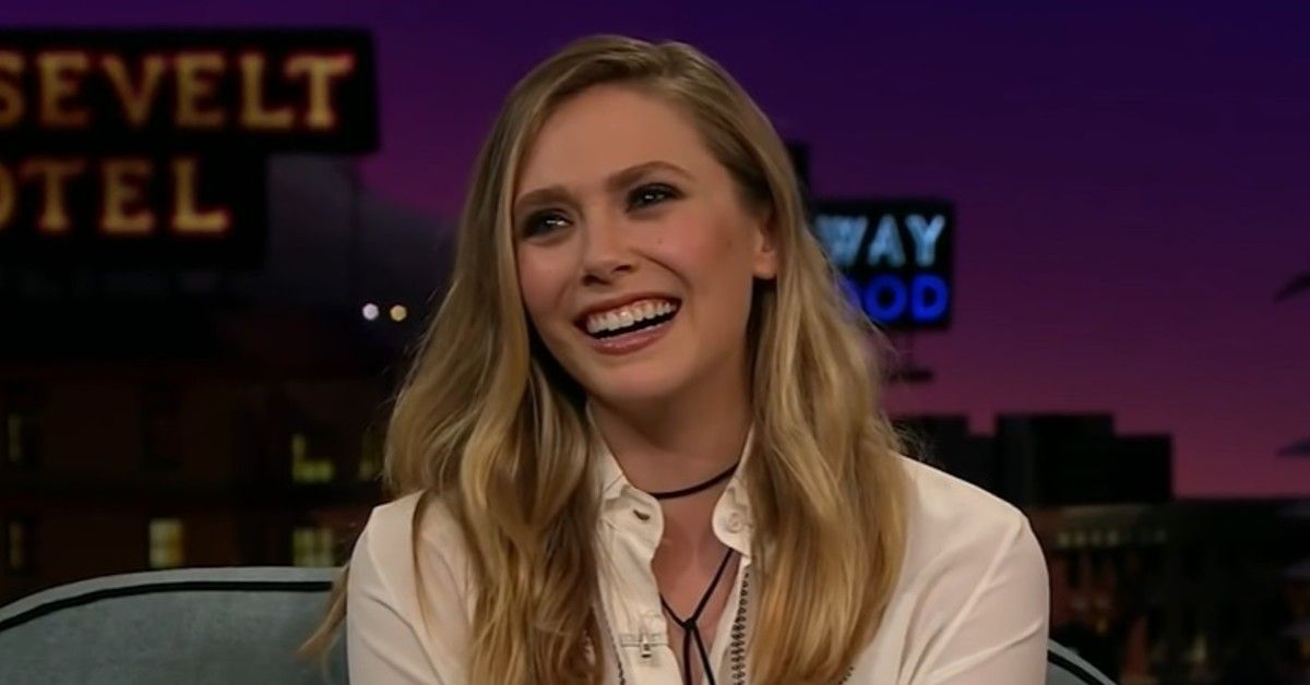 Elizabeth Olsen smiling on a talk show