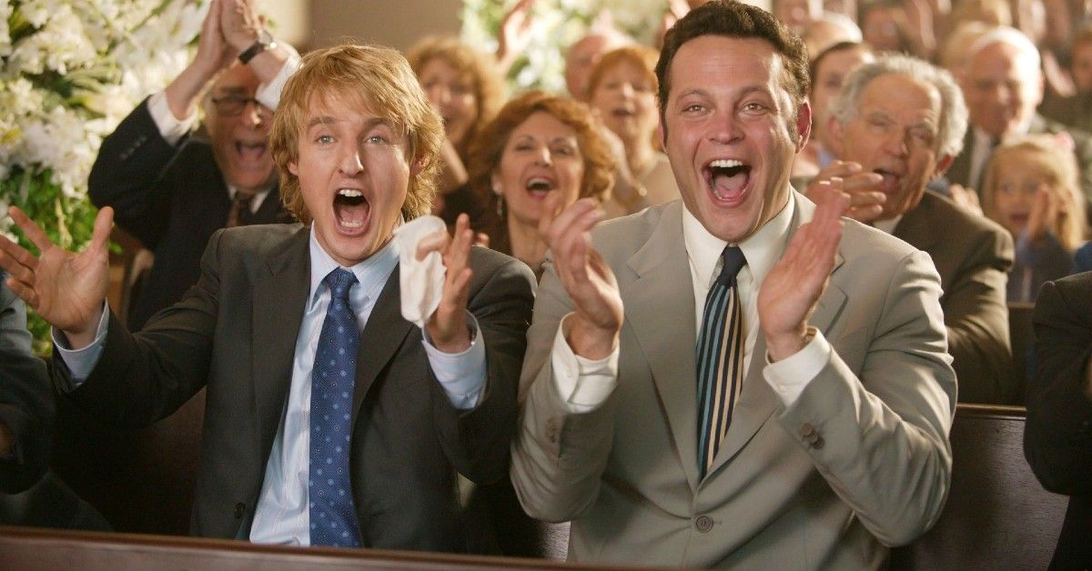 Owen Wilson and Vince Vaughn cheering excitedly in scene from Wedding Crashers.