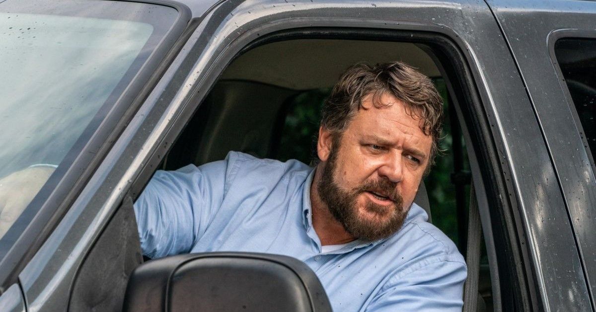 Russell Crowe sits in a blue car in a scene from the movie 'Unhinged'. 