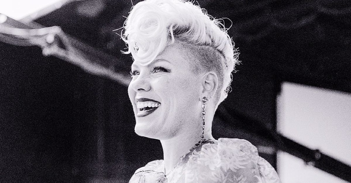Black and white picture of P!nk smiling.