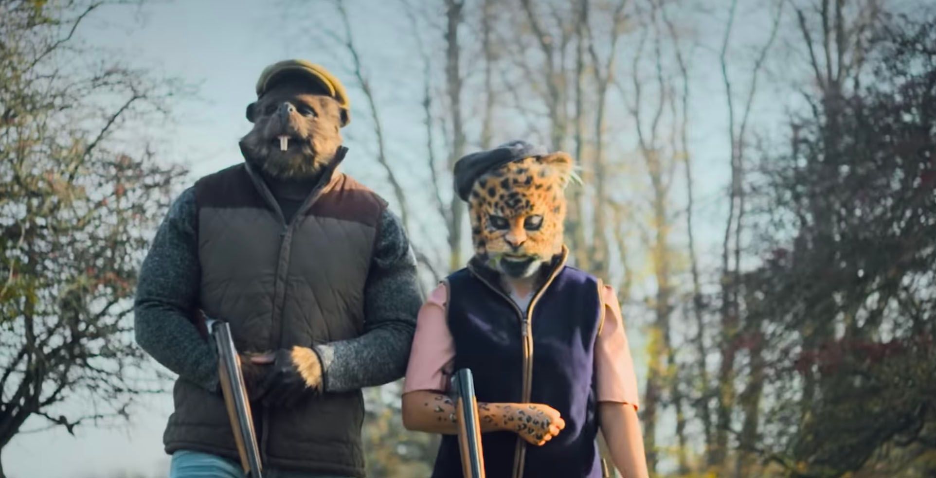 Two contestants wearing masks and walking outside on Sexy Beasts on Netflix