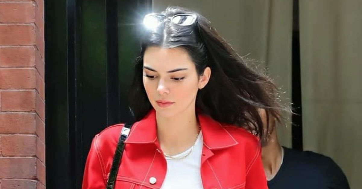 kendall jenner wearing sunglasses and a red top