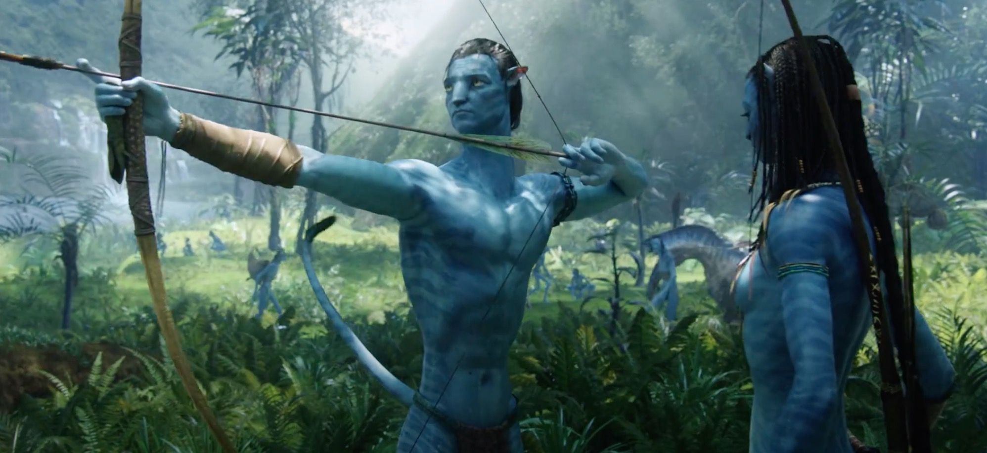 Sam Worthington as his Na'vi avatar holding a bow and arrow next to Neytiri in Avatar.