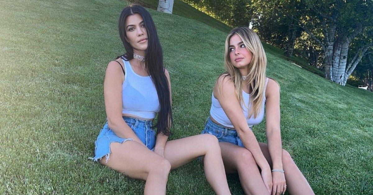 Addison Rae & Kourtney Kardashian on the grass
