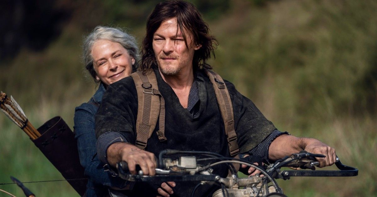 Daryl and Carol riding on a motorcycle in scene for The Walking Dead