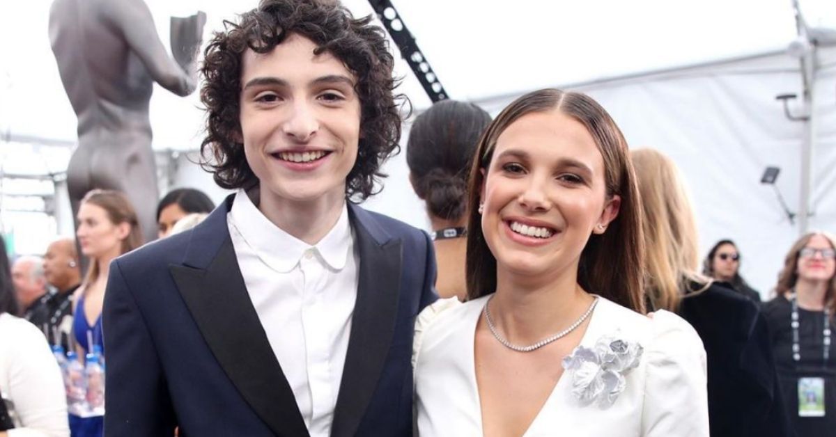 Finn Wolfhard and Millie Bobby Brown together on a red carpet