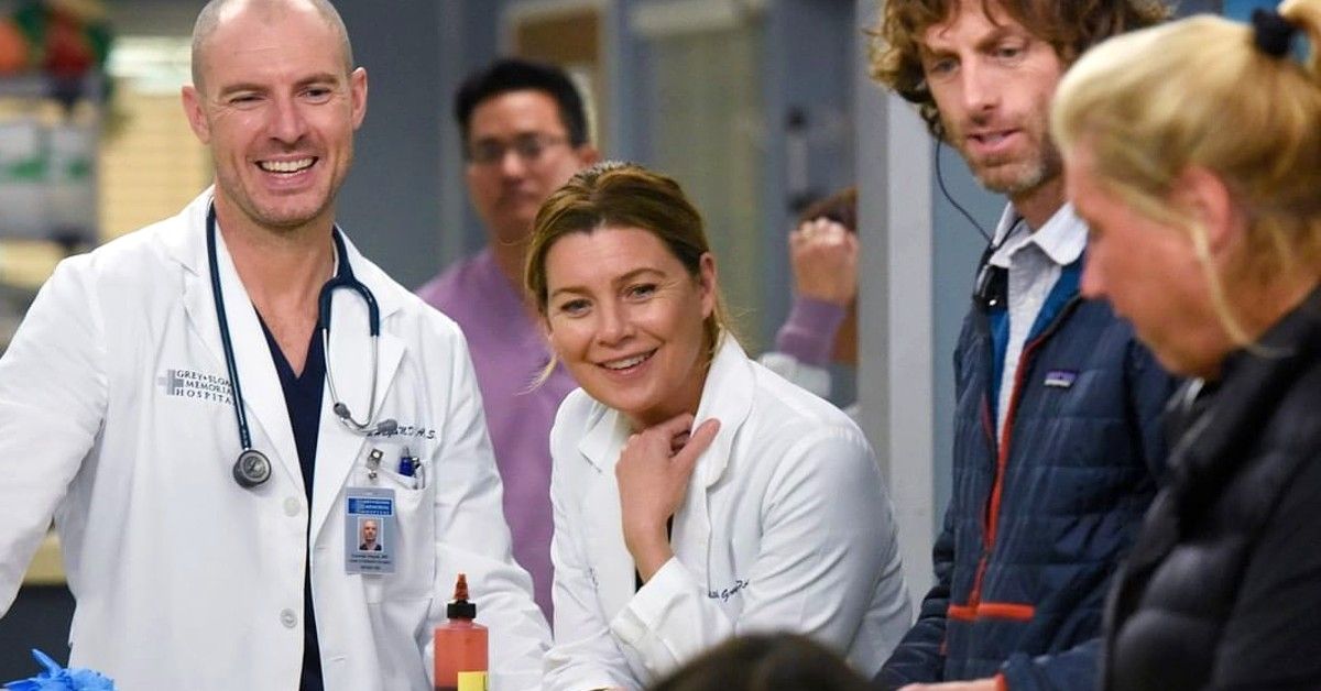 Ellen Pompeo and Richard Flood in doctors outfits for Grey's Anatomy scene